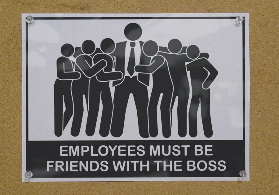 Sign that says "Employees must be friends with boss"