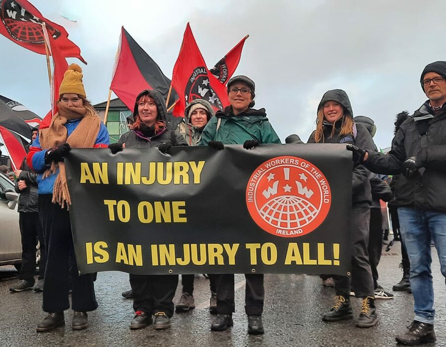 An IWW rally in Ireland. Sign reads "An injury to one is an injury to all."