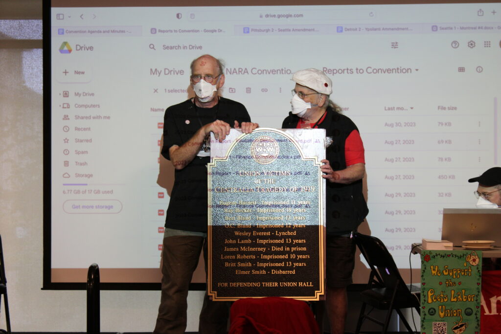  Porco Rossellini 2023. Fellow Workers from the Pacific Northwest present the Centralia tragedy memorial plaque for our fallen Fellow Workers.
