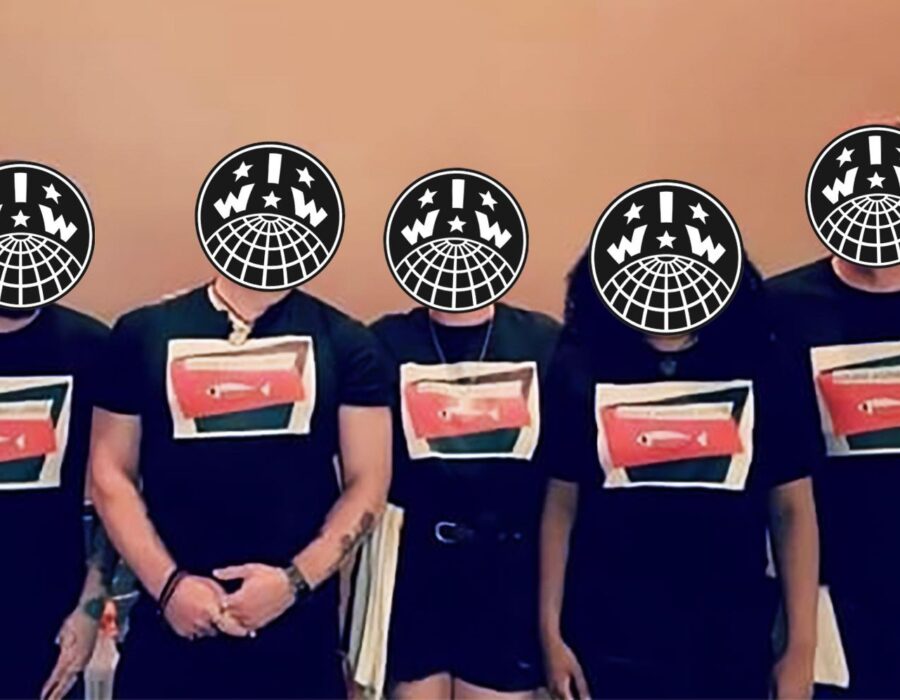 Five Wobblies stand in matching black shirts that have a picture of a fish and say "Sakana IWW"