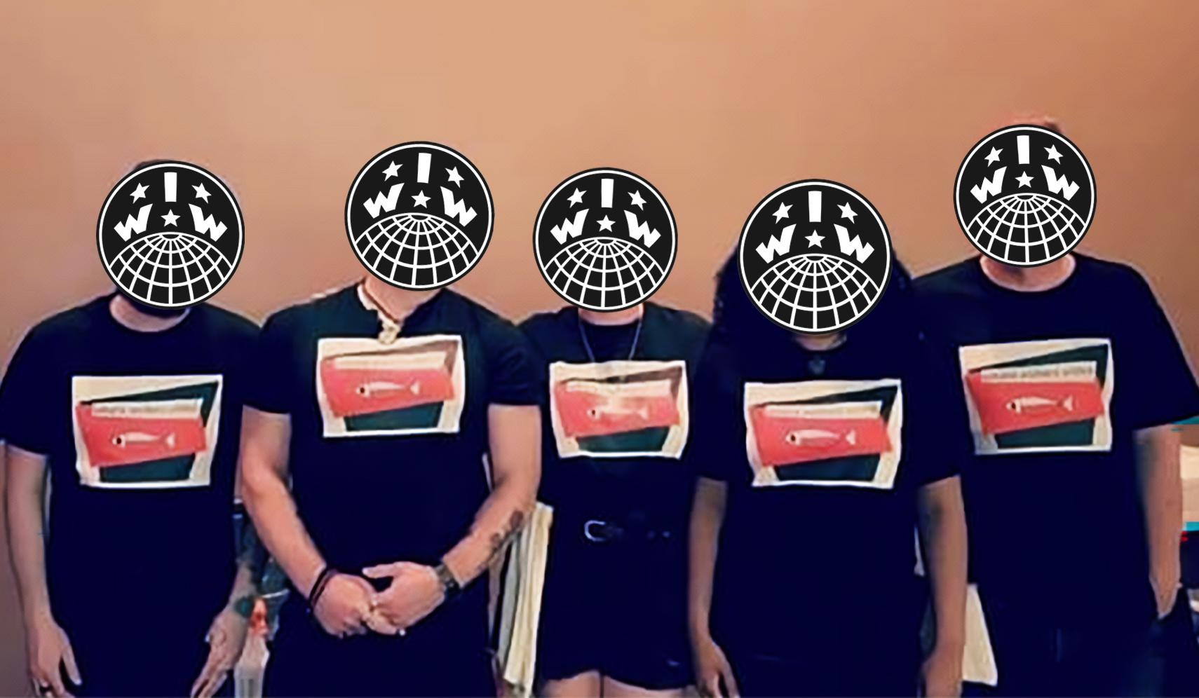 Five Wobblies stand in matching black shirts that have a picture of a fish and say "Sakana IWW"