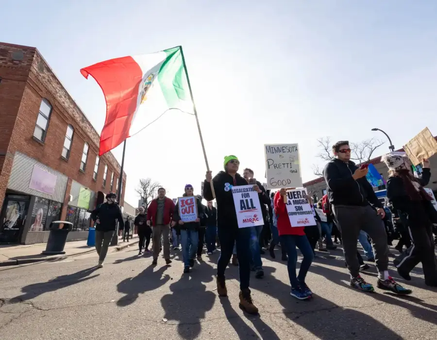 Minnesota Immigrant Rights Action Committee (MIRAC) organized a protest north on Central Avenue Northeast in Minneapolis on February 15, 2026. (c) Carly Danak, MPR news.