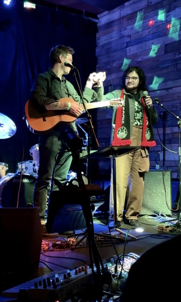 FWs Noah L and Alej sing Solidarity Forever. Courtesy of Denver IWW.