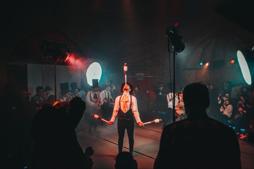 A juggler performs at a circus.